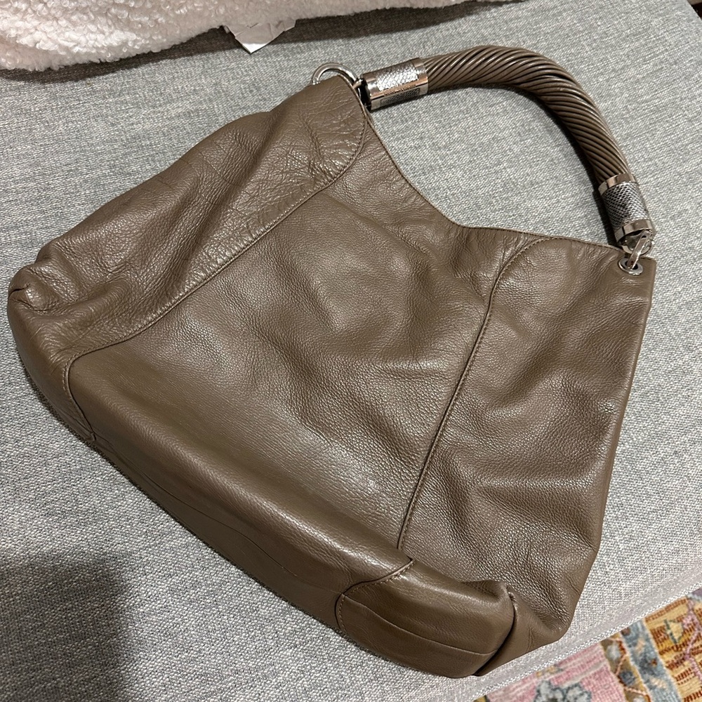 Michael Kors handbag with snake skin accents on hardware